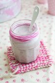 A jar of strawberry and banana yogurt