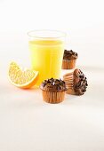 Muffins with chocolate sprinkles; served with freshly squeezed orange juice