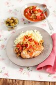 Chicken breast with green olives, onions, tomatoes and rice