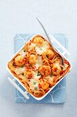 Spaghetti bake with chicken dumplings and tomato sauce