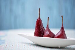 Three red wine poached pears