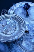 Still-life arrangement with pewter plates and Christmas decorations