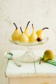 Spiced pears with star anise on a cake stand