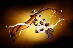Splashes of milk and coffee with coffee beans