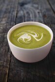 Green cream of vegetable soup with crème fraîche