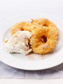 Apple fritters with whipped cream