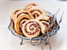 Cinnamon Danish pastries with pastry tongs