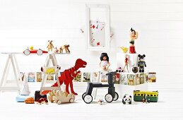 Toy still life with dinosaurs and tricycle