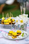 chicken and mango skewers on a baptism party table