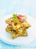 Star-shaped Spanish omelettes with dry-cured ham, stacked