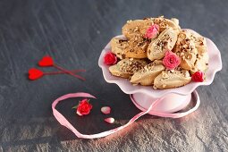 Meringues with cinnamon, nuts and rosebuds