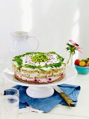 Sandwich cake with vegetables and rocket