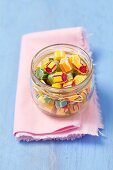 Colourful fruit sweets in a jar