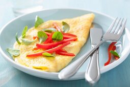 An omelette with pepper and basil