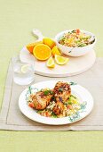 Barbecued drumsticks with orange couscous
