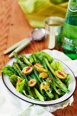 A green asparagus, bean and olive salad