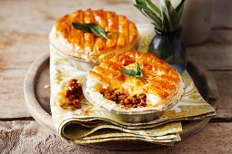 Puff pastry pies filled with minced poultry, sage and pepper