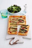 Puff pastry quiche with green asparagus