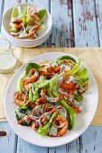 A salad with grilled pineapple, prawns and a basil dressing