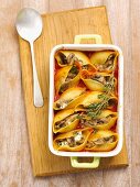 Conchiglie with mushrooms and cheese in tomato sauce