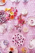 A tea party with cupcakes and flowers