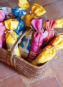 Basket of hand-sewn, silk lavender bags