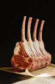 Tomahawk rack of ribs (a rack of beef ribs with extra long bones)