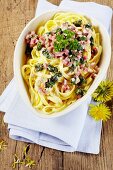 Tagliatelle with bacon and dandelions