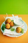 Baked carrot and sweetcorn balls with a yogurt dip