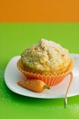A carrot muffin with a marzipan carrot