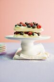Meringue cake with passion fruit mousse and berries