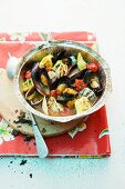 Grilled mussels with tortellini and tomatoes