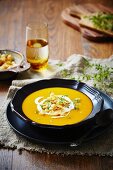 Pumpkin and carrot soup with creme fraiche