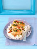 Salmon fillet with rice, chilli peppers, spring onions and coriander