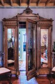 Antique, mirrored wardrobe with secret door