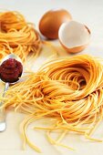 Flavoured pasta: tagliolini with egg and tomato puree
