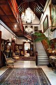 Magnificent foyer with chandeliers and antique furniture in restored Neo-gothic building