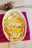 Potato and Jerusalem artichoke gratin in a baking dish