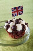 A cupcake decorated with the Union Jack flag