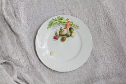 Mixed pickles on a white porcelain plate