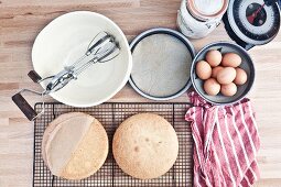 A bird's-eye view of utensils and ingredients for making sponge cake