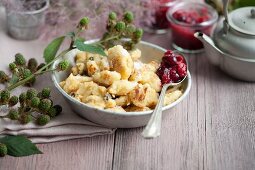 Kaiserschmarrn (shredded sugared pancake from Austria) with raspberry and cranberry jam
