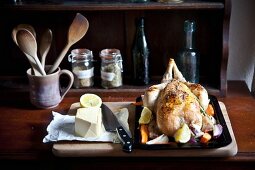 Roast chicken with root vegetables, butter and herbs