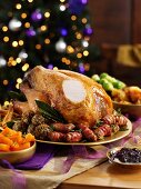 Sliced roast turkey with all the trimmings on a festive table