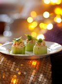 Cucumber rolls filled with prawns for Christmas