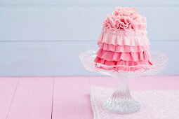 A mini cake with pink icing