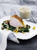 Five-spice turkey breast on a bed of spinach