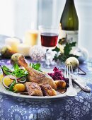 Duck leg with red cabbage and potatoes