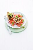 Minced meat tartlets on tomato salad