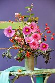 Autumnal bouquet with cornel cherries, hawthorn, rose hips, snowberry, elder, dahlias & cosmos